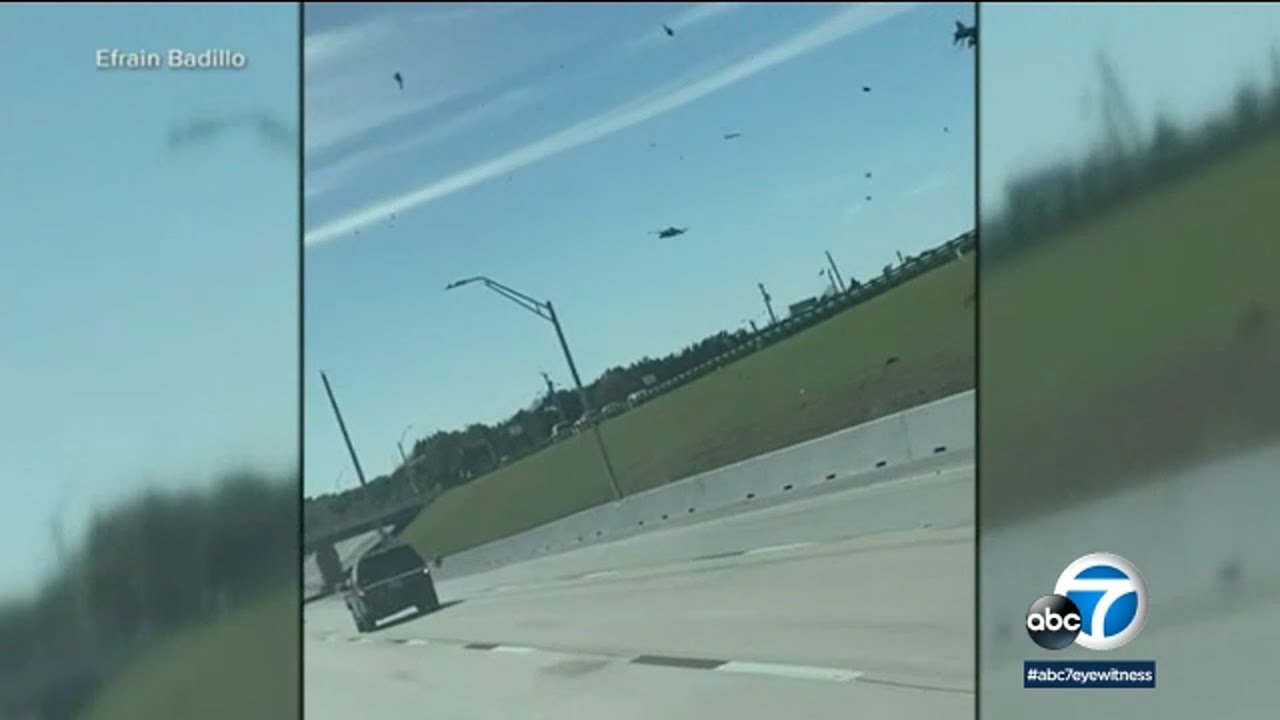 Video shows debris falling onto highway after 2 aircraft crash mid-air during Dallas WWII airshow